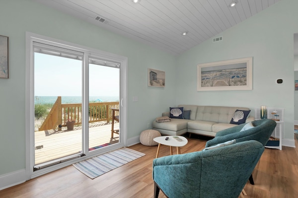 Cozy living room with sliders right out onto the back deck and ocean access