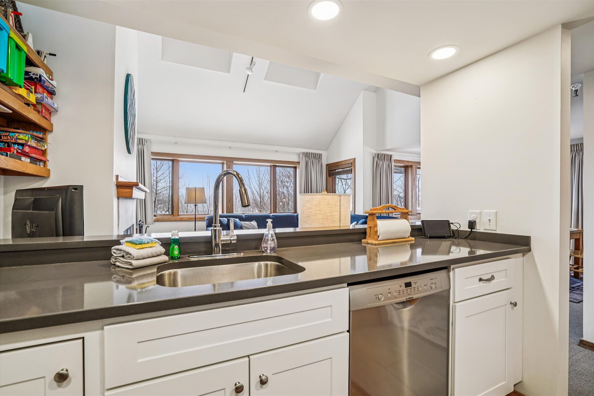 Kitchen with Breakfast Bar & Open Sightlines - Enjoy cooking while staying connected to the living area through the open pass-through design.
