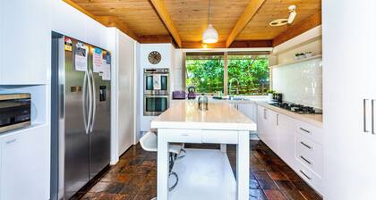 Relax in nature with 4K cinema room near Air port.