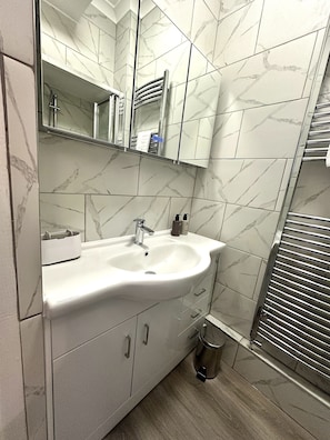 Shower, hair dryer, towels, soap