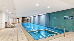 An indoor swimming pool with a depth of 1.2 meters, tiled walls, and a tiled floor. - Belle Escapes - Glenelg Seaside Apartment (Glenelg)
