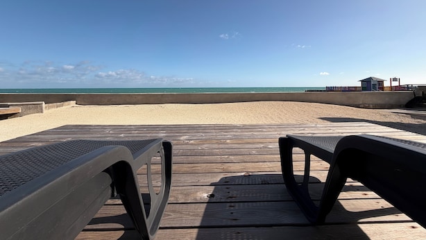 A wooden deck with benches overlooking a beach. - Beachfront Villa on Andros Island, Bahamas (Andros Town)