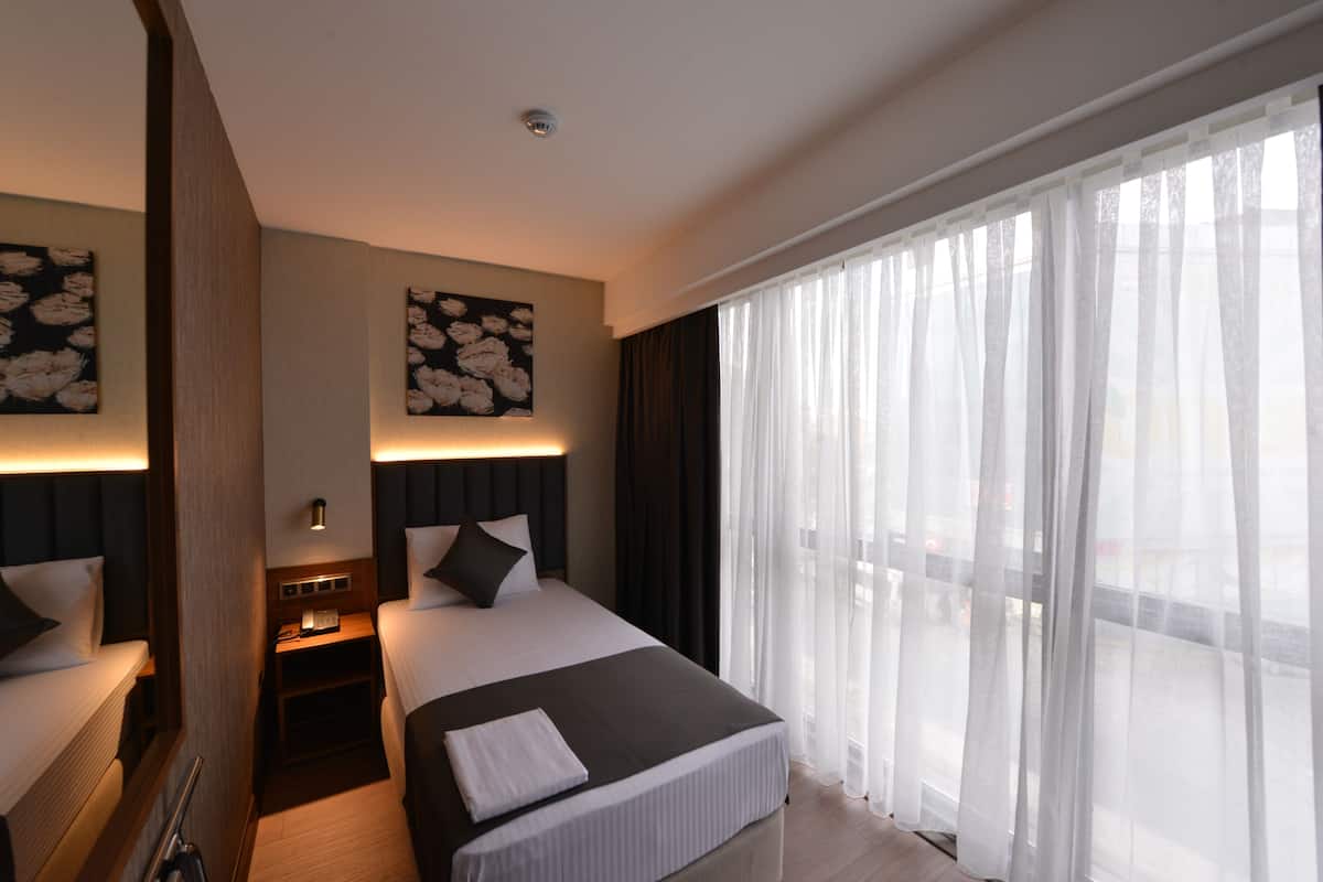 Deluxe Single Room | 1 habitación, ropa de cama de alta calidad y edredón