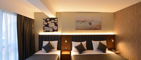 Premium bedding, down duvets, free minibar items, in-room safe