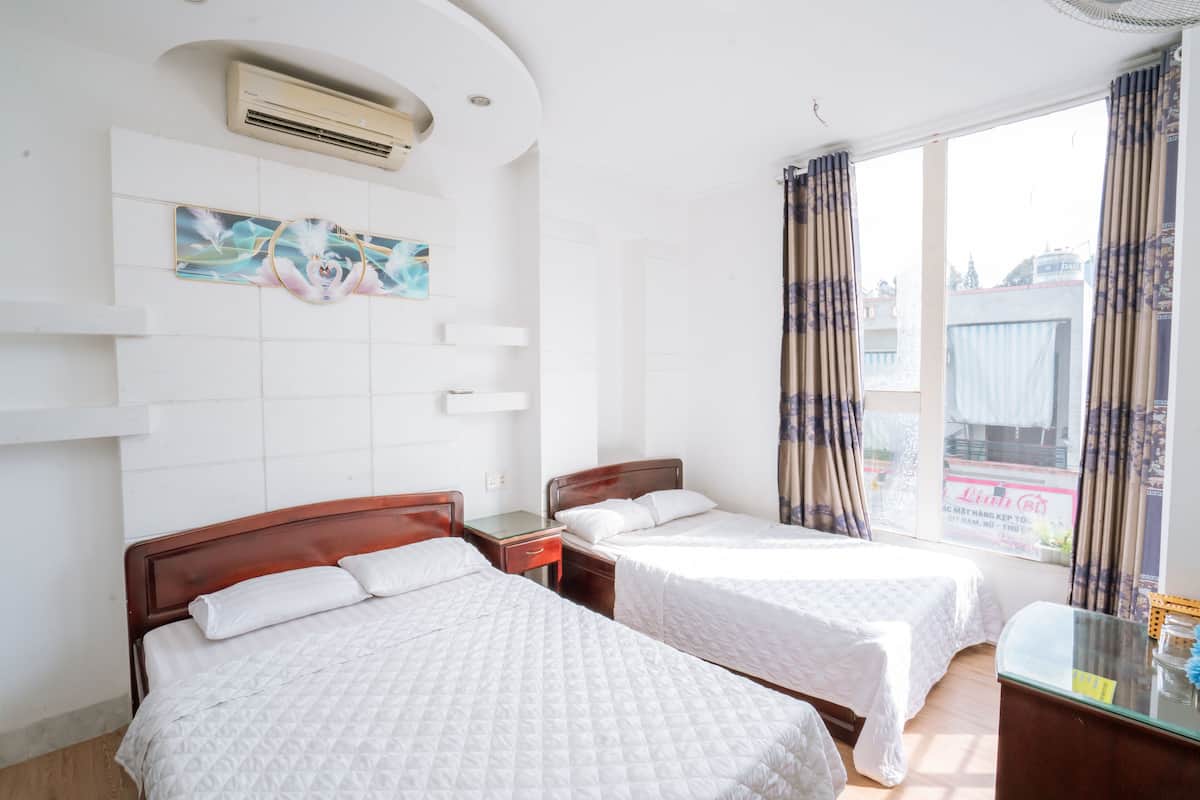 Family Quadruple Room, City View | Minibar, desk, laptop workspace, soundproofing