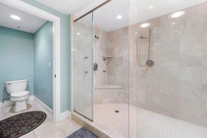 Shower, hair dryer, towels, shampoo
