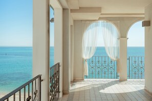 A balcony with a view of the sea, a tiled floor, and a white curtain. - Life Hotel Seaview & Spa (Porto Recanati)