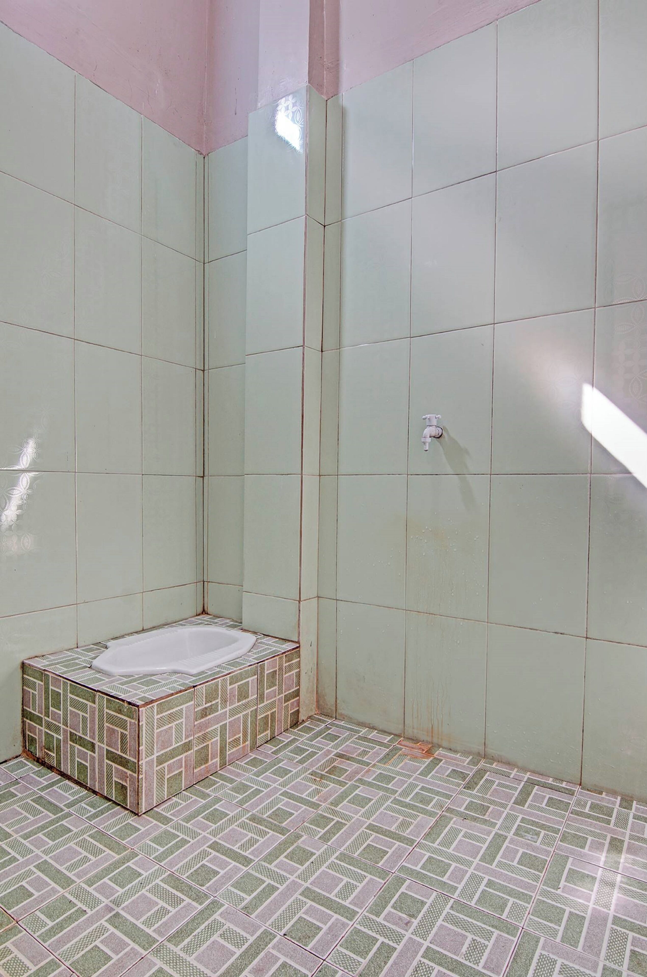 Foto - Hotel O Penginapan Puti SyariahNearBandara Sultan Syarif Kasim II