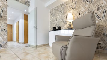 Deluxe Apartment | Living room | 32-inch flat-screen TV with digital channels