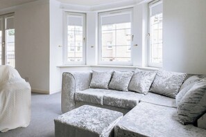 Basic Apartment, Multiple Beds | Living area | TV
