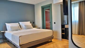 Relax in comfort with a large bed, bench, and ample storage in this stylish room.