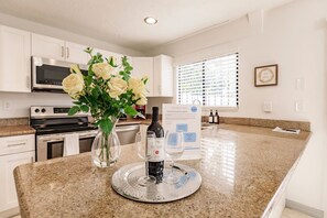 Fridge, coffee/tea maker, cookware/dishes/utensils