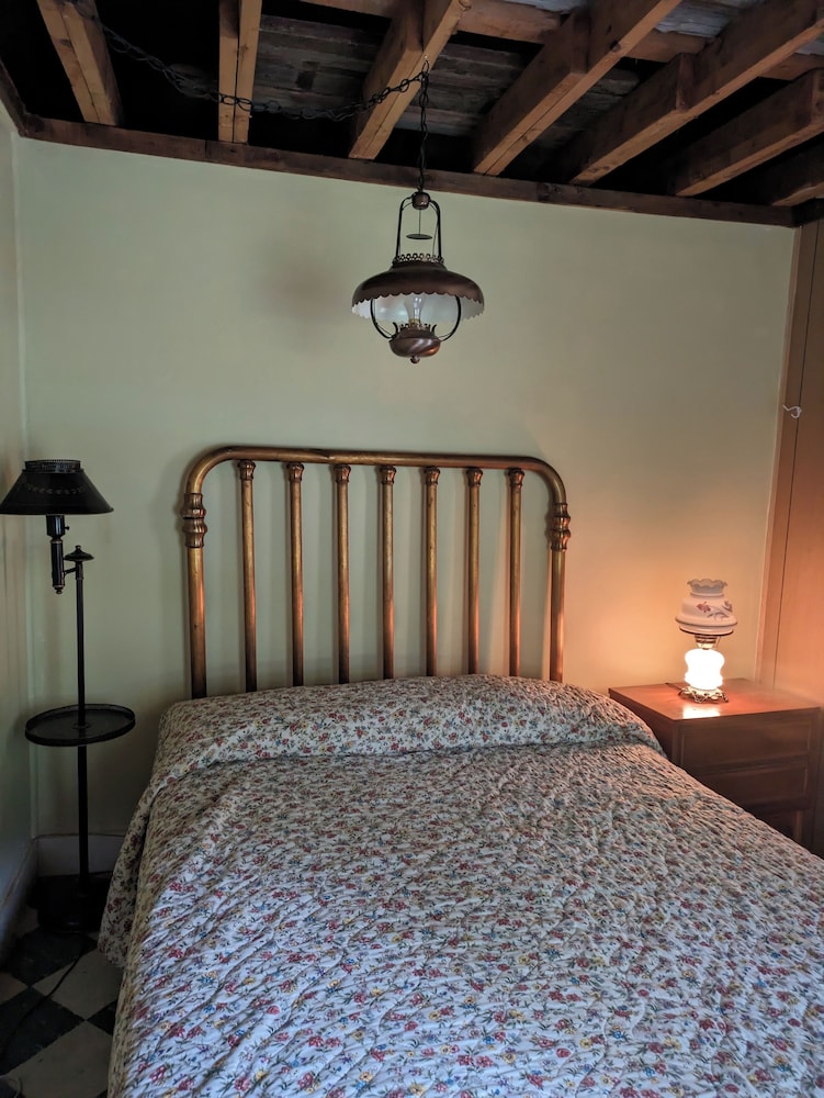 Direct lakefront cottage with wood burning fireplace in great room. Pet