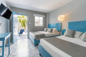 A hotel room with two beds, a TV, a desk, and a view of the outdoors. - Hotel ADAZ Mediterraneo (Santa Marta)