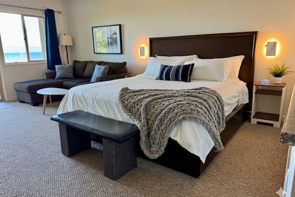 Comfortable King-Sized bed with Ocean Views.