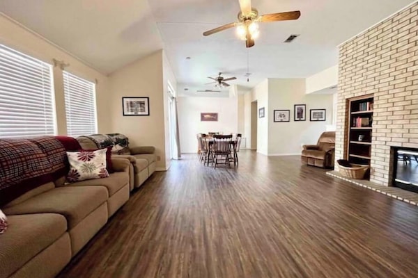 Spacious living room with fireplace and 50" tv