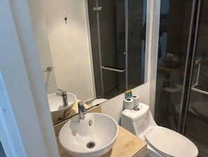 Shower, hair dryer, towels, soap