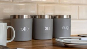 Three gray containers labeled coffee, tea, and sugar on a wooden surface. - 4 Bed Town House - Reading Cent. (Reading)