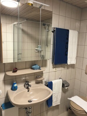 Shower, hair dryer, towels, soap