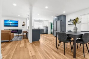 Enjoy meals in the dining area with a flat-screen TV and comfortable seating.
