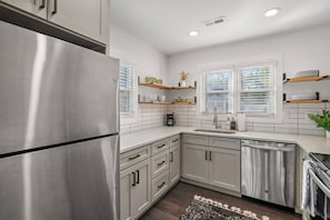 Fridge, coffee/tea maker, cookware/dishes/utensils
