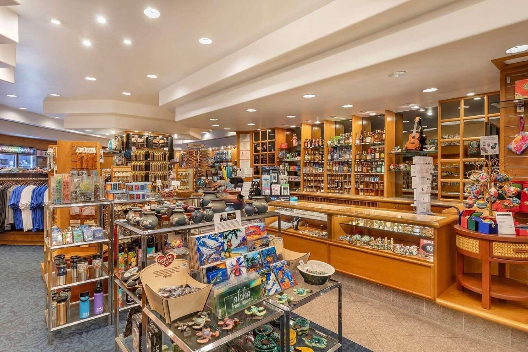A well-lit store with various items on display, including clothing, kitchenware, and decorative objects.