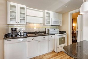 Enjoy cooking in this well-equipped kitchen with an oven, coffee maker, and toaster.
