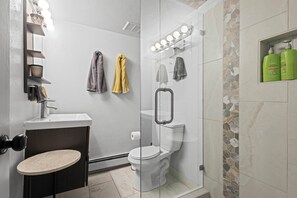 Shower, hair dryer, towels, soap