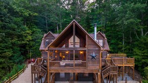 A wooden cabin with a balcony, a star decoration, and a chimney. - 10% Off Member Deal•OMG Views•10 Min to Downtown•Private•Hot Tub•Deck•Firepit (Blue Ridge)