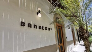 A building facade with the name "BANDERA" prominently displayed. - Newly designed 3BR apartment + Private terrace (Ciudad de Panamá)