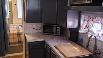 Fridge, microwave, coffee/tea maker, toaster