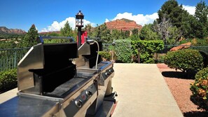 Enjoy al fresco dining with a grill and mountain views.