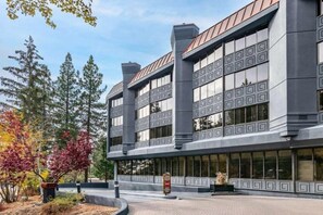 Stylish building with a geometric pattern and landscaped surroundings.