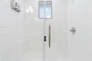 Shower, hair dryer, towels, soap