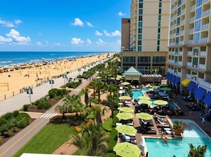 A resort with a pool area, beach access, and a view of the ocean. - Virginia Beach | Ocean View Stay | Pool & Beach | 1BR (Virginia Beach)