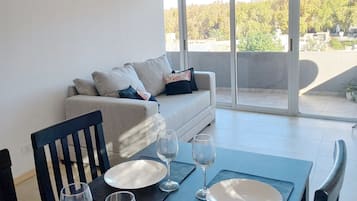 Premium Apartment | Living area | Flat-screen TV