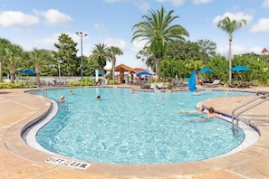 A swimming pool with a 3ft depth and 0.9m width, surrounded by palm trees and lounge chairs.