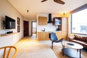 Deluxe Apartment, 1 Bedroom, Balcony, Sea View | Living area | 40-inch Smart TV with satellite channels, Netflix, Hulu - Serenity Residences & Spa - Kokrobite (Kokrobite)