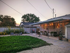 Enjoy outdoor dining and social gatherings on the covered patio with grill and seating.