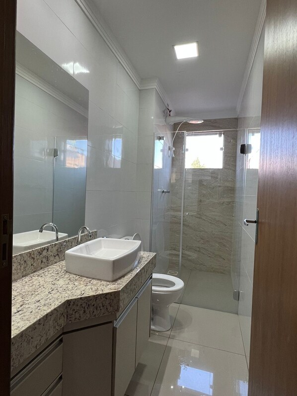 Bidet, towels, toilet paper