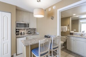 Fridge, microwave, stovetop, coffee/tea maker