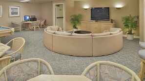 Relax in comfort with a spacious seating area, flat-screen TV, and desk for work or leisure.