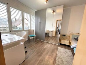 1 bedroom, desk, travel crib, bed sheets