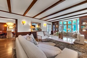 Smart TV, fireplace, books, computer monitors