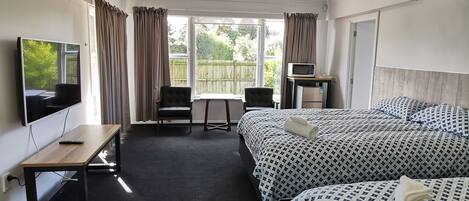 Family Room | Blackout curtains, free WiFi, bed sheets