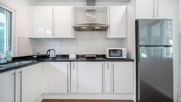 Fridge, microwave, cookware/dishes/utensils