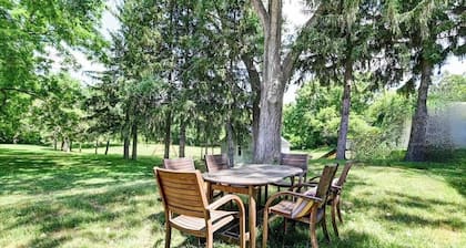 Look out at the treetops at the cozy Paoli Nest. Near Epic Systems and Madison.