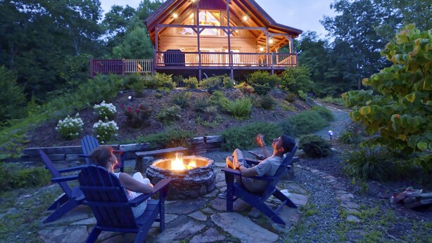 A lodge with a fire pit and outdoor seating. - Mountain Cabin, Hot Tub, Fire Pit, Views, Outdoor Bar, Stocked Kitchen (Bryson City)
