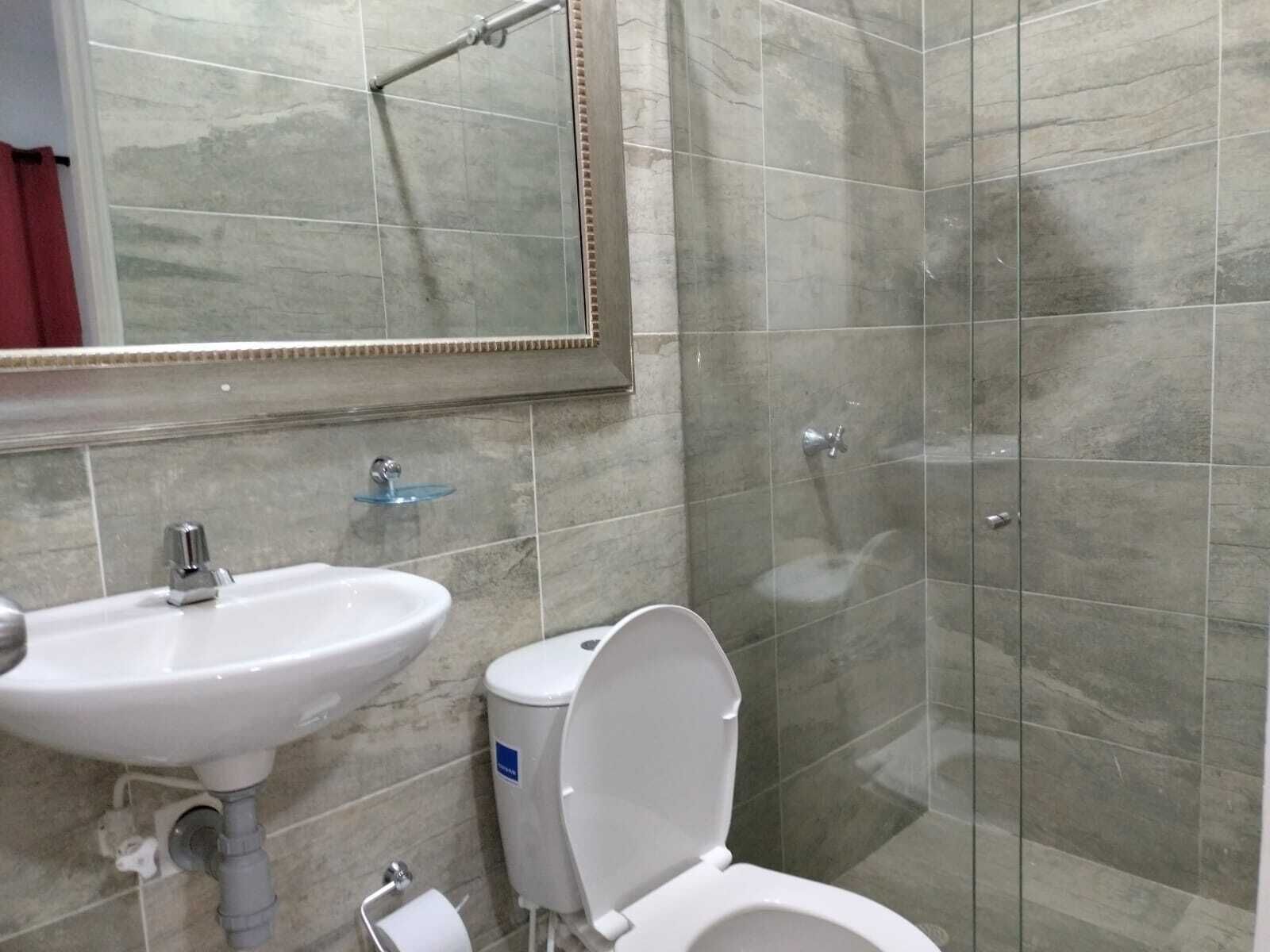 family apartment, multiple beds, garden view | bathroom | shower, rainfall showerhead, towels, soap