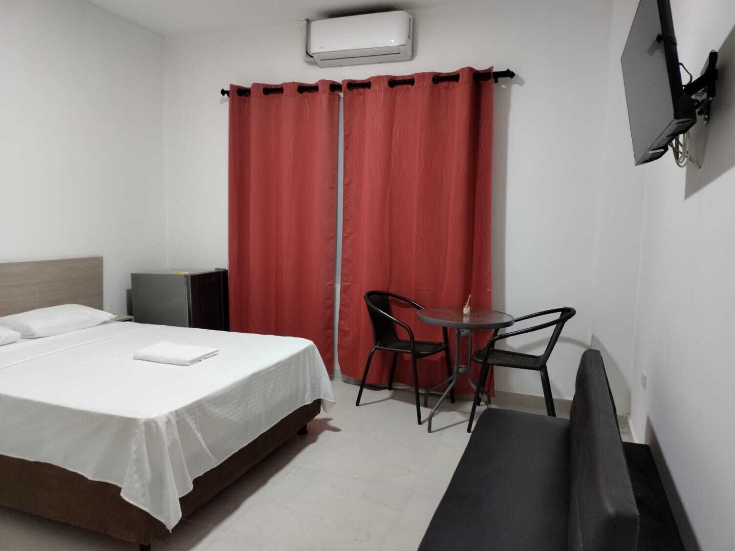 comfort double room, 1 queen bed, garden view, ground floor | premium bedding, minibar, blackout curtains, free wifi